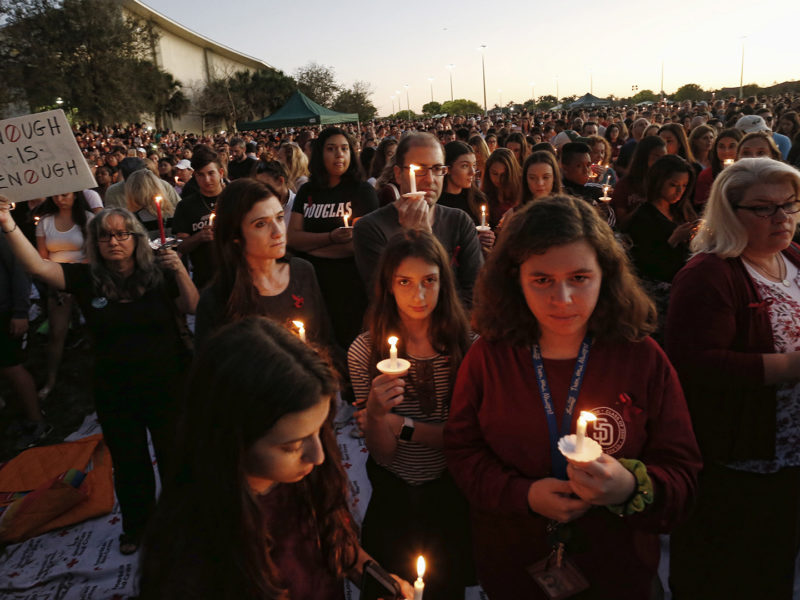 Mourners hold vigils in Florida town after 17 killed in high school shooting